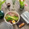 Bagasse Round Bowl 1000ml full of fresh food on a wooden table